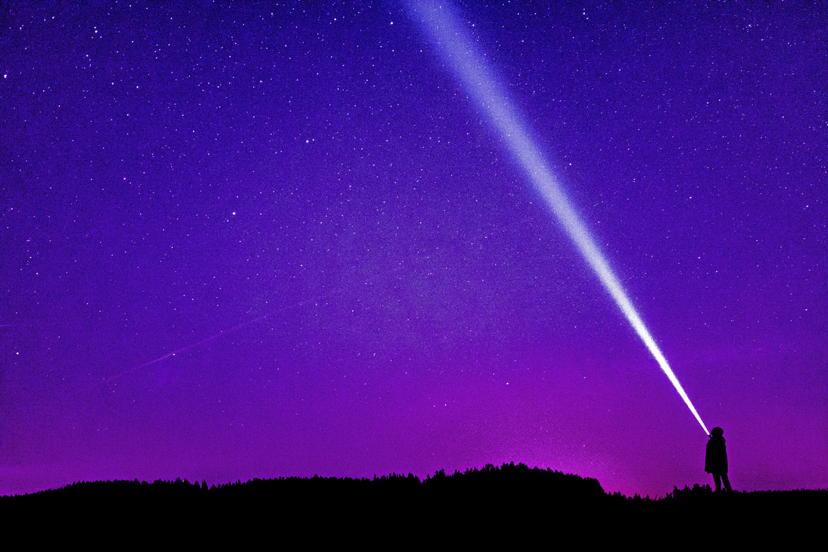 Silhouette of Person Under Blue and Purple Sky